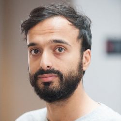 Headshot of Sohail Jannesari, a brown person with a black beard and short black hair.