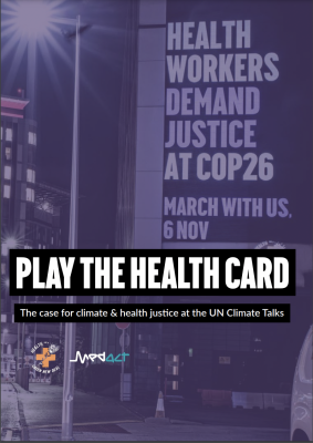"Play the health card: The case for climate & health justice at the UN Climate Talks" - Health for a Green New Deal, Medact. The image is a projection on a large building, with a hospital in the background - the projection reads "Health workers demand justice at COP26"
