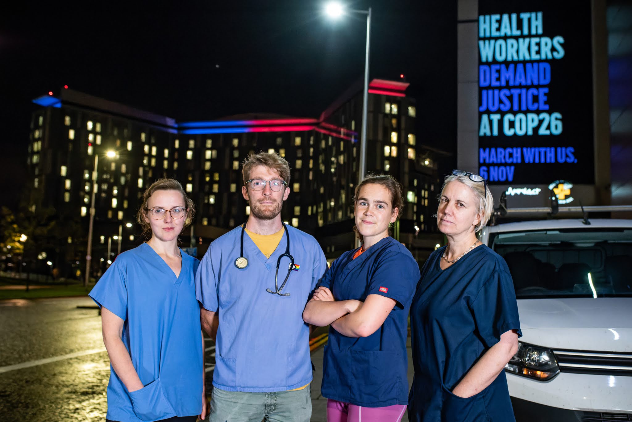Scottish health workers at the projection stunt ahead of COP26, outside Glasgow Royal Infirmary, 18th October 2022.