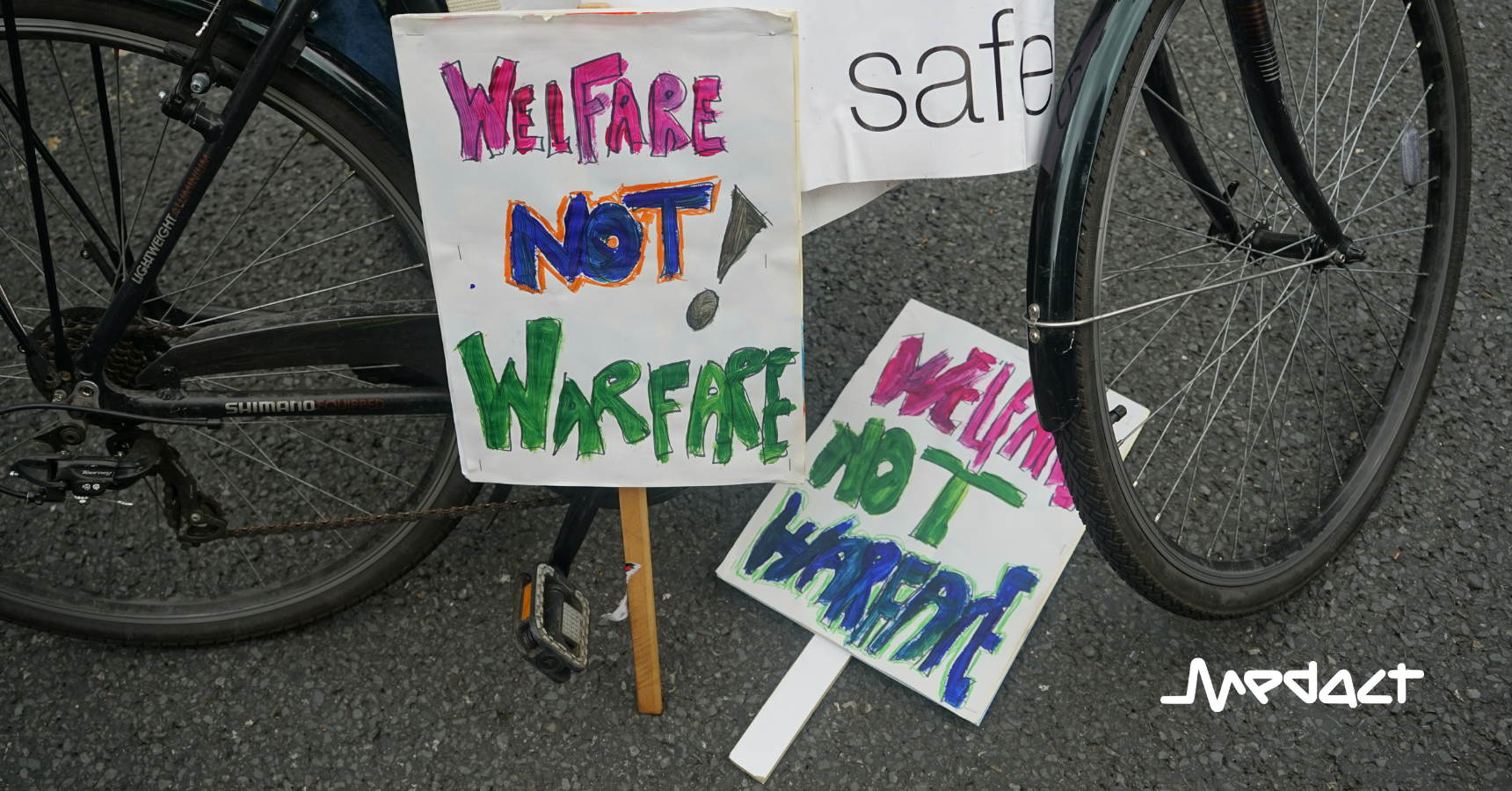 Medact placards "Welfare, Not Warfare!"