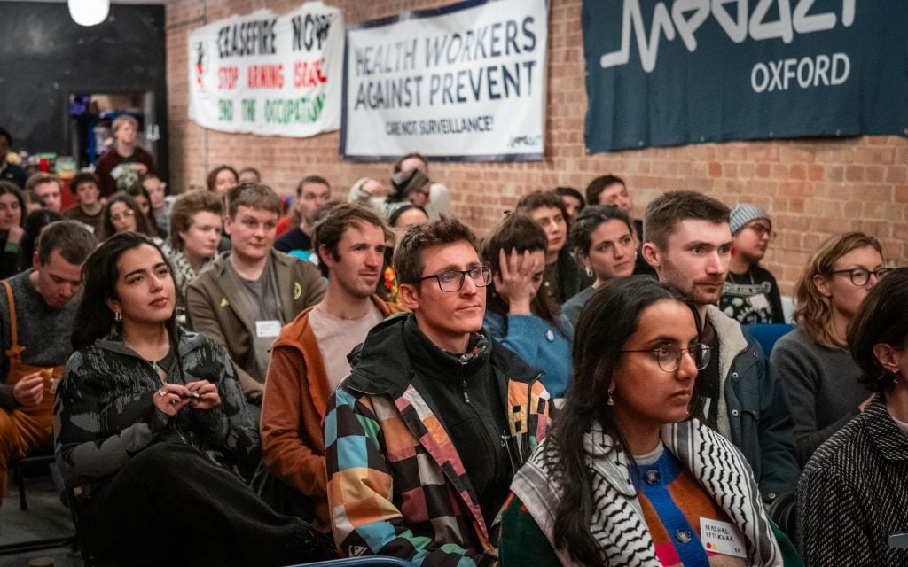 A view of Medact members sitting at the 2024 gathering at Pelican House
