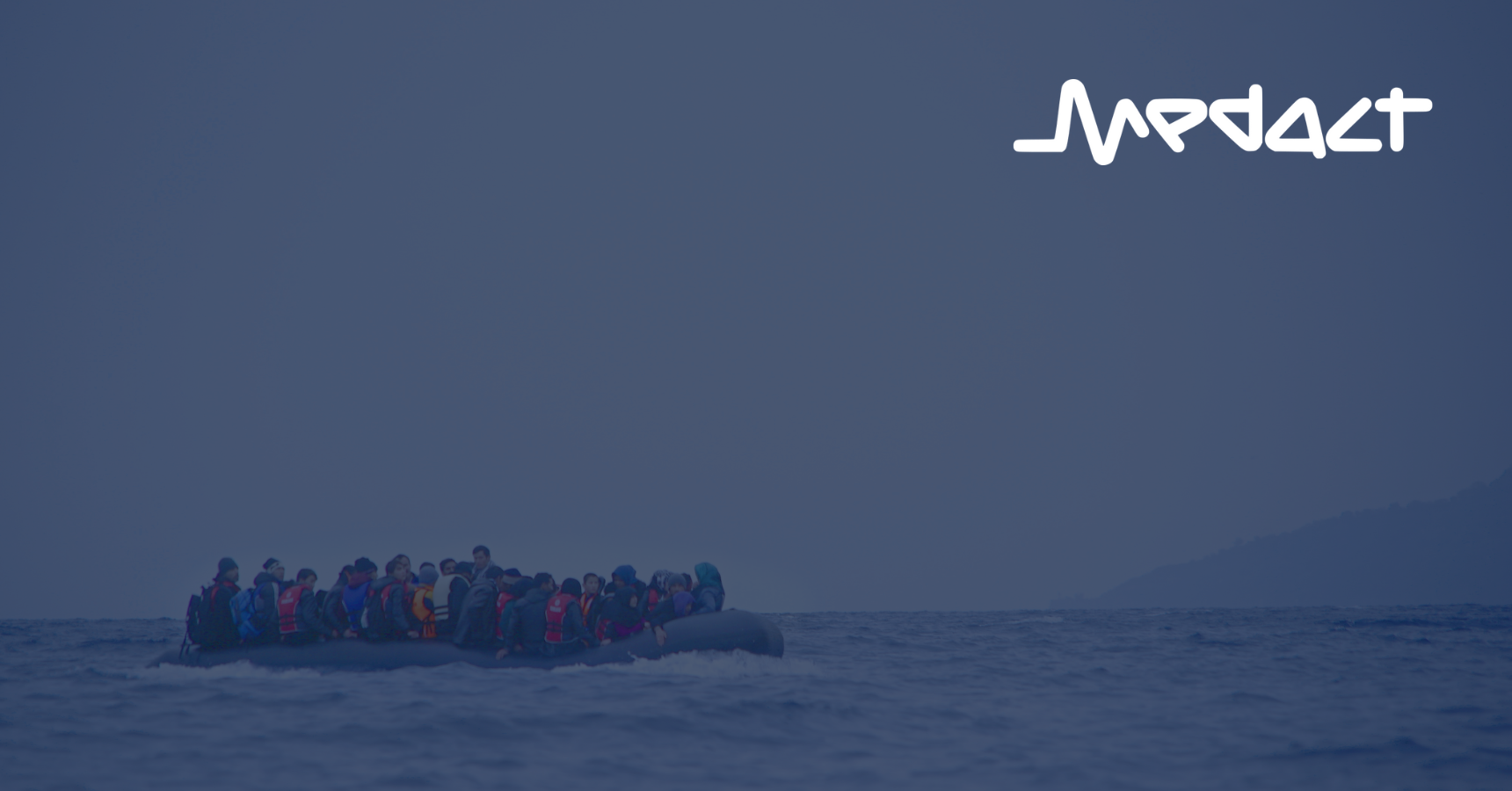 Refugees on a boat crossing the Mediterranean sea