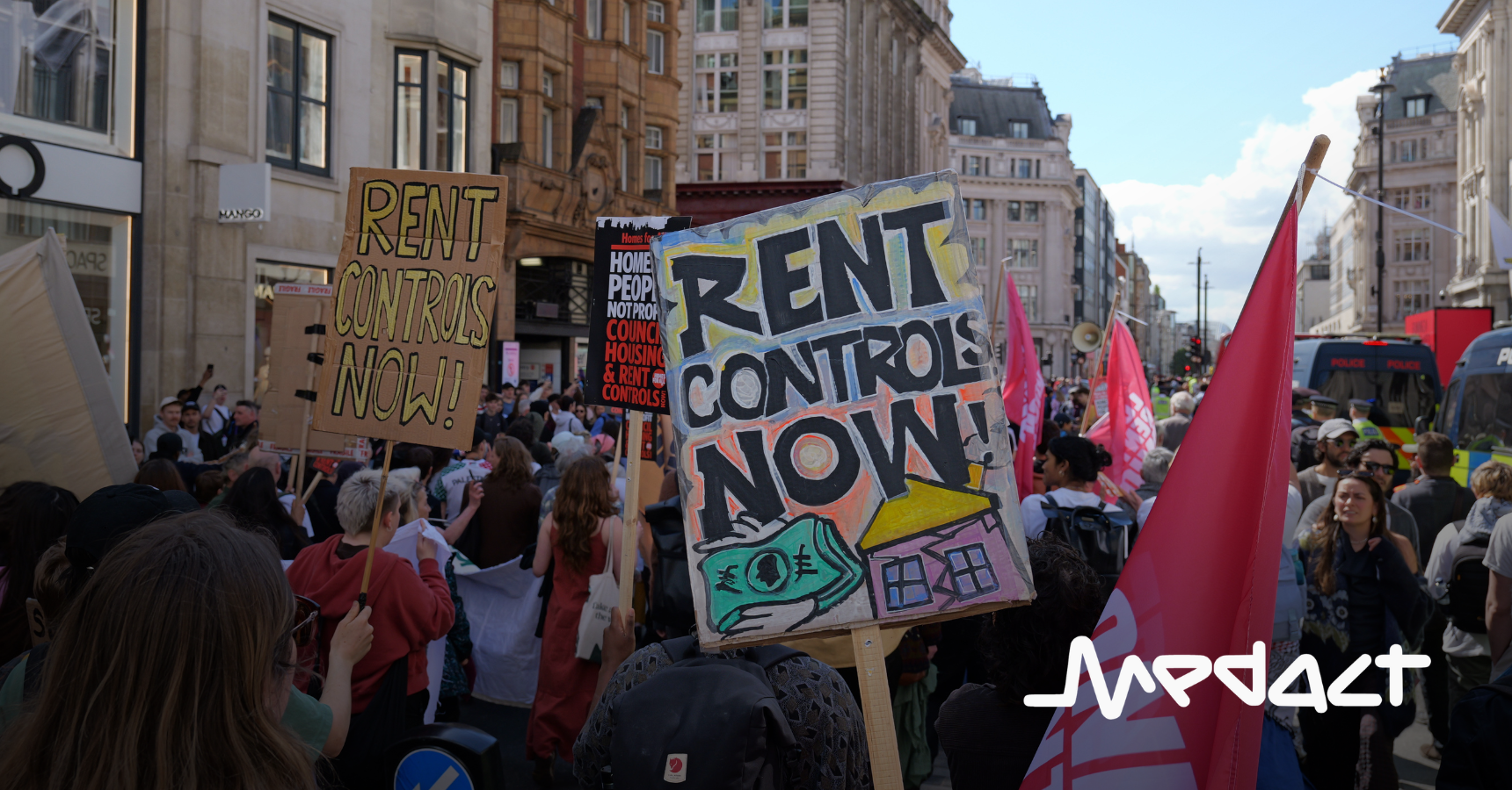 Two placards saying "Rent Controls Now" from the National Housing Demo in April 2026